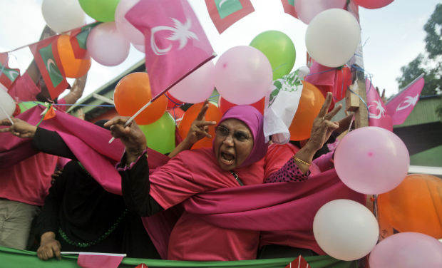 Supporter of presidential candidate Abdulla Yameen, a brother of 30-year autocratic ruler Maumoon Abdul Gayoom, shouts slogans during a campaign rally ahead of the presidential runoff in Male, Maldives on Friday - AP Supporter of presidential candidate Abdulla Yameen, a brother of 30-year autocratic ruler Maumoon Abdul Gayoom, shouts slogans during a campaign rally ahead of the presidential runoff in Male, Maldives on Friday - AP